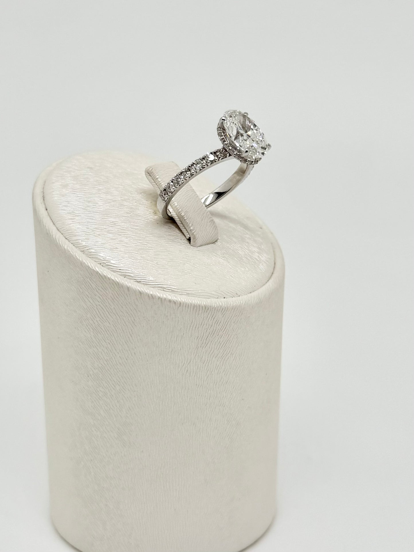 White gold ring set with an oval diamond