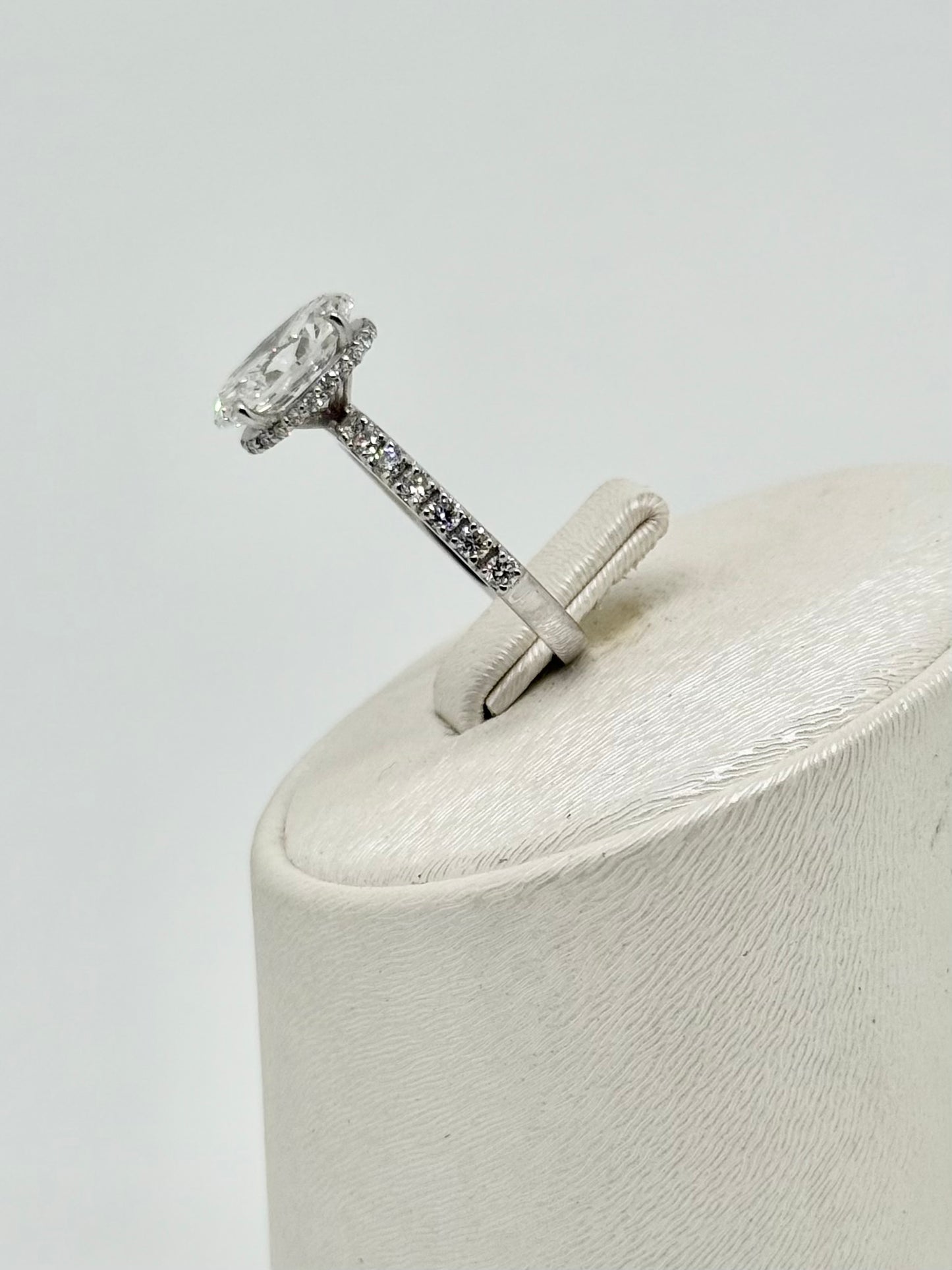 White gold ring set with an oval diamond