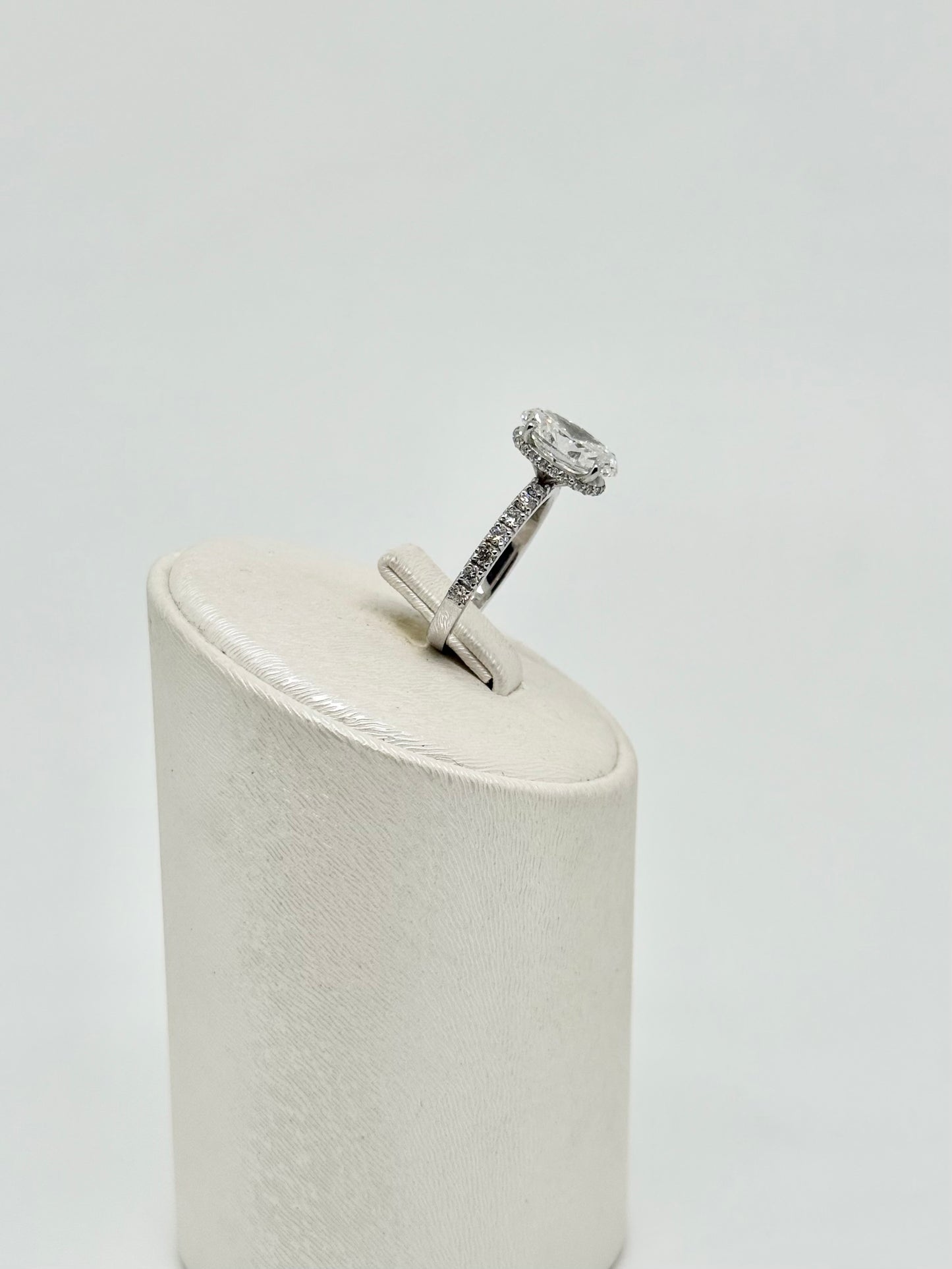 White gold ring set with an oval diamond