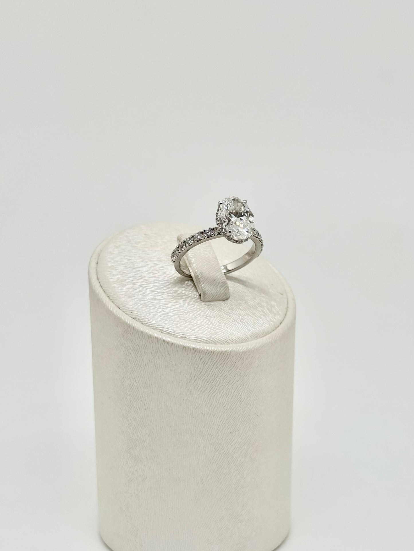 White gold ring set with an oval diamond