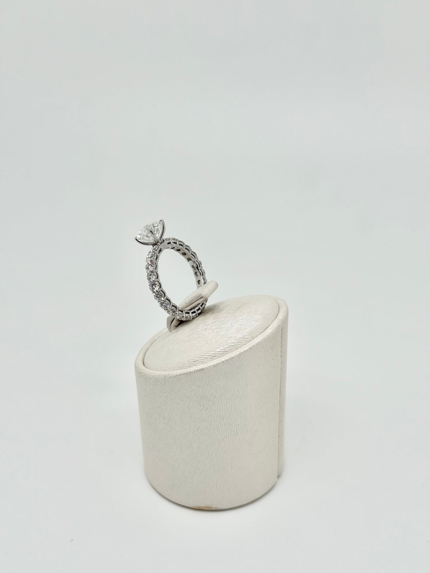 White gold eternity ring set with a 2.01 ct center stone