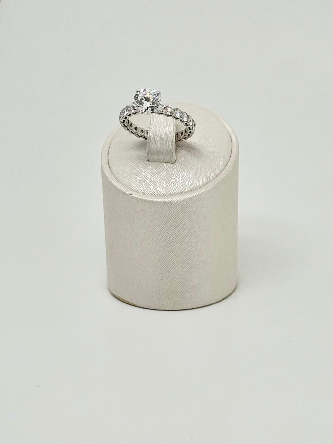 White gold eternity ring set with a 2.01 ct center stone