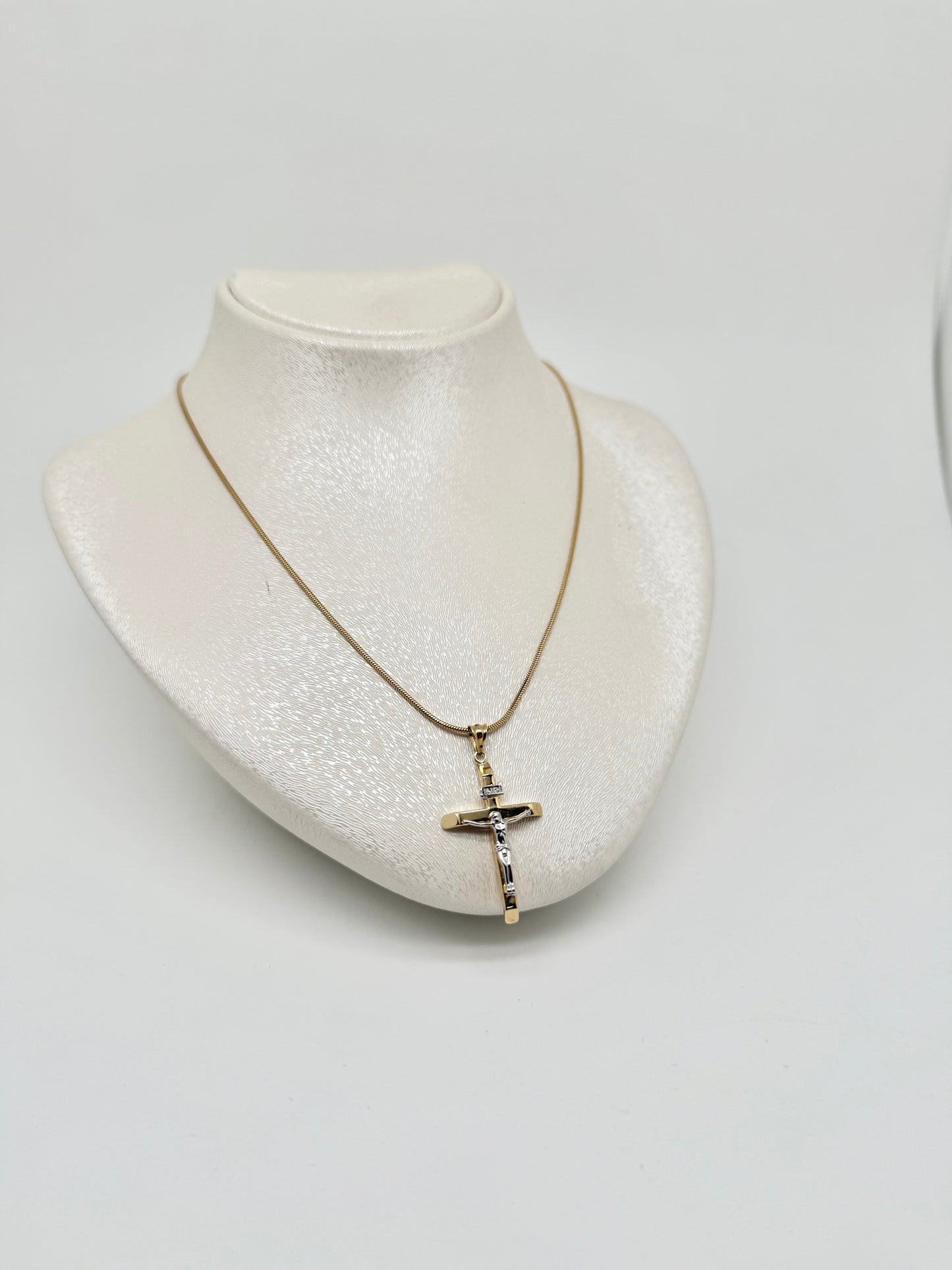 Yellow gold necklace with white and yellow gold cross pendant