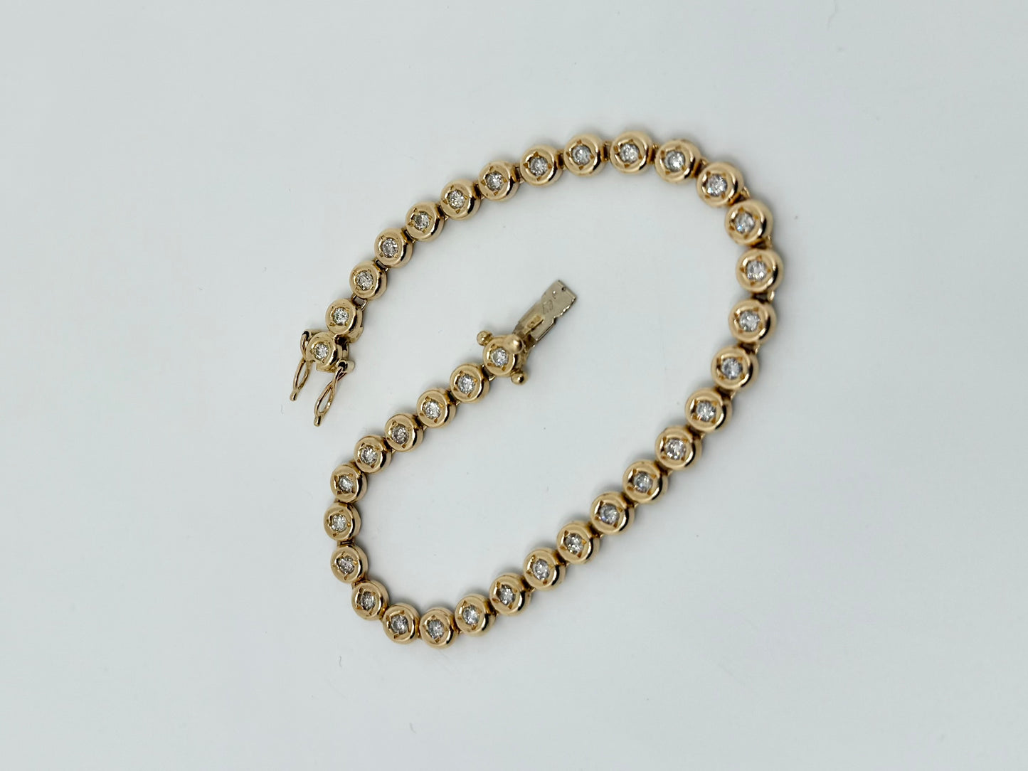 Yellow gold 'Tennis' bracelet, natural diamonds
