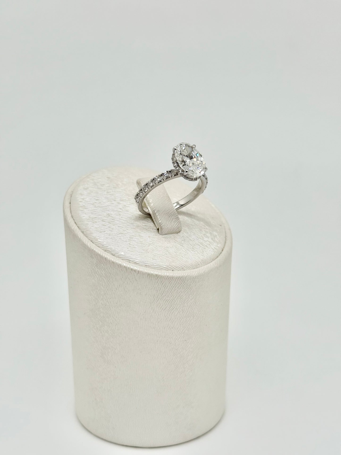 White gold ring set with an oval diamond 