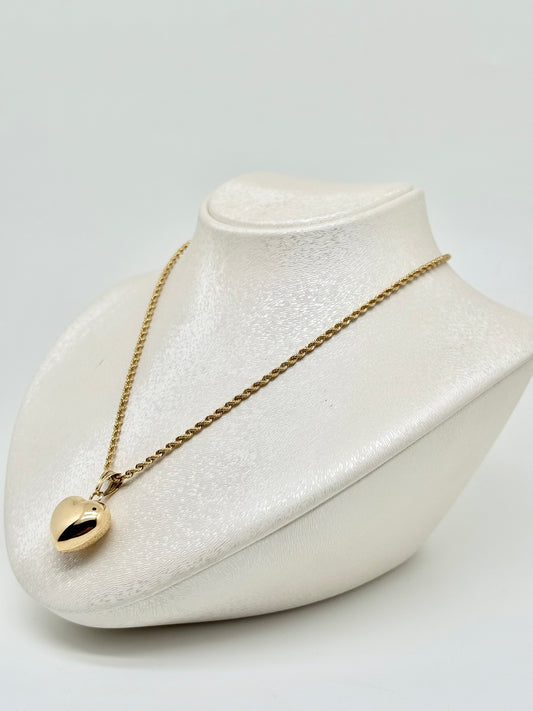 Twisted yellow gold necklace with reversible heart pendant